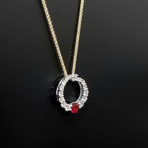 ruby and diamond pendant with yellow gold chain